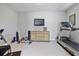 Well-equipped home gym featuring a treadmill, weights, and a flatscreen TV at 1111 143Rd Ne St, Bradenton, FL 34212