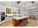 Gourmet kitchen with a large island, pendant lighting, and stainless steel appliances at 1111 143Rd Ne St, Bradenton, FL 34212