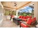 Inviting lanai with comfortable seating, outdoor kitchen, and stone flooring creates a relaxing outdoor retreat at 1111 143Rd Ne St, Bradenton, FL 34212