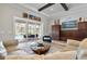 Living area with glass doors opening to a pool and patio area at 1111 143Rd Ne St, Bradenton, FL 34212