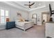 Spacious main bedroom boasts a tray ceiling, neutral decor, and an ensuite bathroom at 1111 143Rd Ne St, Bradenton, FL 34212