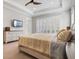 Tranquil primary bedroom with a ceiling fan, plantation shutters, and ample natural light at 1111 143Rd Ne St, Bradenton, FL 34212