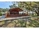 Restrooms and covered picnic tables in a shaded park area at 1111 143Rd Ne St, Bradenton, FL 34212