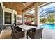 Covered patio with dining table and pool view at 1111 143Rd Ne St, Bradenton, FL 34212