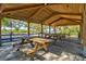 Covered picnic pavilion with wooden tables at 1111 143Rd Ne St, Bradenton, FL 34212