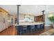 Spacious gourmet kitchen featuring a large island, custom cabinets, and hardwood floors at 1233 N Gulfstream Ave # 1001, Sarasota, FL 34236