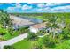 Luxury home with lush landscaping and golf course views at 5591 Downham Meadows, Sarasota, FL 34235