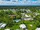 Aerial view of community with tennis courts, pickleball courts, and swimming pool at 6421 Kilohee Ct, North Port, FL 34287