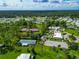 Aerial view of community amenities including tennis courts, shuffleboard, and pool at 6421 Kilohee Ct, North Port, FL 34287