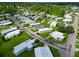 Aerial view of a mobile home community, showcasing the property's location and surroundings at 6421 Kilohee Ct, North Port, FL 34287