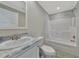 Updated bathroom with a tub shower combo at 6421 Kilohee Ct, North Port, FL 34287