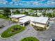 Aerial view of community center with parking lot and landscaping at 6421 Kilohee Ct, North Port, FL 34287