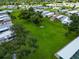 Aerial view of community green space with homes in the background at 6421 Kilohee Ct, North Port, FL 34287
