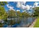 Serene community lake with lush landscaping and tranquil views at 6421 Kilohee Ct, North Port, FL 34287