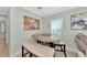 Small dining area with a unique triangular table and bench seating at 6421 Kilohee Ct, North Port, FL 34287