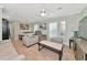 Spacious living room with light gray couches and a coffee table at 6421 Kilohee Ct, North Port, FL 34287