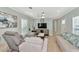 Bright and airy living room with comfortable seating and a large TV at 6421 Kilohee Ct, North Port, FL 34287