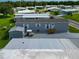 Mobile home with shed, golf cart, and paved driveway at 6421 Kilohee Ct, North Port, FL 34287