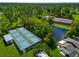 Community pickleball courts nestled near a pond at 6421 Kilohee Ct, North Port, FL 34287