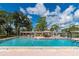 Community pool with plenty of lounge chairs for relaxing and socializing at 6421 Kilohee Ct, North Port, FL 34287