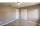 Spacious bedroom with double door closet and wood-look flooring at 7137 Natchez Ct, North Port, FL 34287