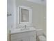 Bathroom with white vanity, quartz countertop and LED mirror at 4210 Caddie E Dr # 102, Bradenton, FL 34203