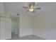 Spacious bedroom with wood-look floors and ceiling fan at 4210 Caddie E Dr # 102, Bradenton, FL 34203