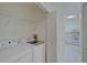 Laundry room with washer, dryer, and built-in shelving at 4210 Caddie E Dr # 102, Bradenton, FL 34203