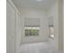 Small spare bedroom with double door closet and two windows at 4210 Caddie E Dr # 102, Bradenton, FL 34203