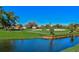 Scenic golf course view with water feature and lush greenery at 4210 Caddie E Dr # 102, Bradenton, FL 34203