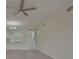 Living room with wood-look floors and access to a lanai at 4210 Caddie E Dr # 102, Bradenton, FL 34203