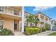 Two-story building with balconies and lush landscaping at 4210 Caddie E Dr # 102, Bradenton, FL 34203