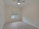 Well-lit bedroom with wood-look floors and ceiling fan at 4210 Caddie E Dr # 102, Bradenton, FL 34203