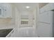 Bright eat-in kitchen features white appliances and quartz countertops at 4210 Caddie E Dr # 102, Bradenton, FL 34203