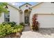 Inviting home exterior with a landscaped walkway at 6746 Devesta Loop, Palmetto, FL 34221