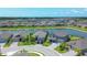 Aerial view of a beautiful community with a lake at 16833 Terrapin Key Dr, Port Charlotte, FL 33953