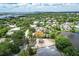 Aerial view showcasing a neighborhood near the water at 4431 Camino Real, Sarasota, FL 34231