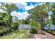 Beautiful waterfront lot with lush landscaping and privacy at 4431 Camino Real, Sarasota, FL 34231