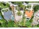 Aerial view of waterfront homes and properties, including a vacant lot at 4431 Camino Real, Sarasota, FL 34231