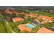 Aerial view of community pool and surrounding buildings at 7131 Boca Grove Pl # 202, Lakewood Ranch, FL 34202