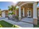 Home exterior featuring a covered entryway and landscaping at 15912 Melport Cir, Port Charlotte, FL 33981