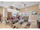 Spacious living room with comfy seating and a view to the kitchen and dining area at 15912 Melport Cir, Port Charlotte, FL 33981