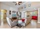 Open living room showcasing comfortable seating and views to entryway and kitchen at 15912 Melport Cir, Port Charlotte, FL 33981
