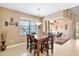 Bright dining area with table and chairs, access to a patio at 15912 Melport Cir, Port Charlotte, FL 33981