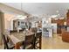 Open concept dining area with kitchen and living room views at 15912 Melport Cir, Port Charlotte, FL 33981