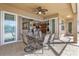 Covered patio with seating area and view into the kitchen and living areas at 15912 Melport Cir, Port Charlotte, FL 33981