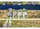 Aerial perspective of four adjacent waterfront homes with pools at 15912 Melport Cir, Port Charlotte, FL 33981