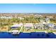 Aerial view of a neighborhood with several waterfront homes and pools at 15912 Melport Cir, Port Charlotte, FL 33981