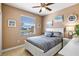 Bedroom with a queen-size bed, nightstand, and window with water view at 15912 Melport Cir, Port Charlotte, FL 33981