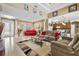 Open living area with comfortable seating and views to kitchen and entryway at 15912 Melport Cir, Port Charlotte, FL 33981